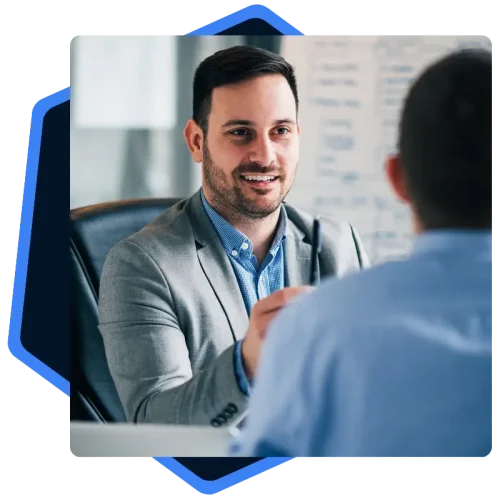 Male cybersecurity professional meeting with client image